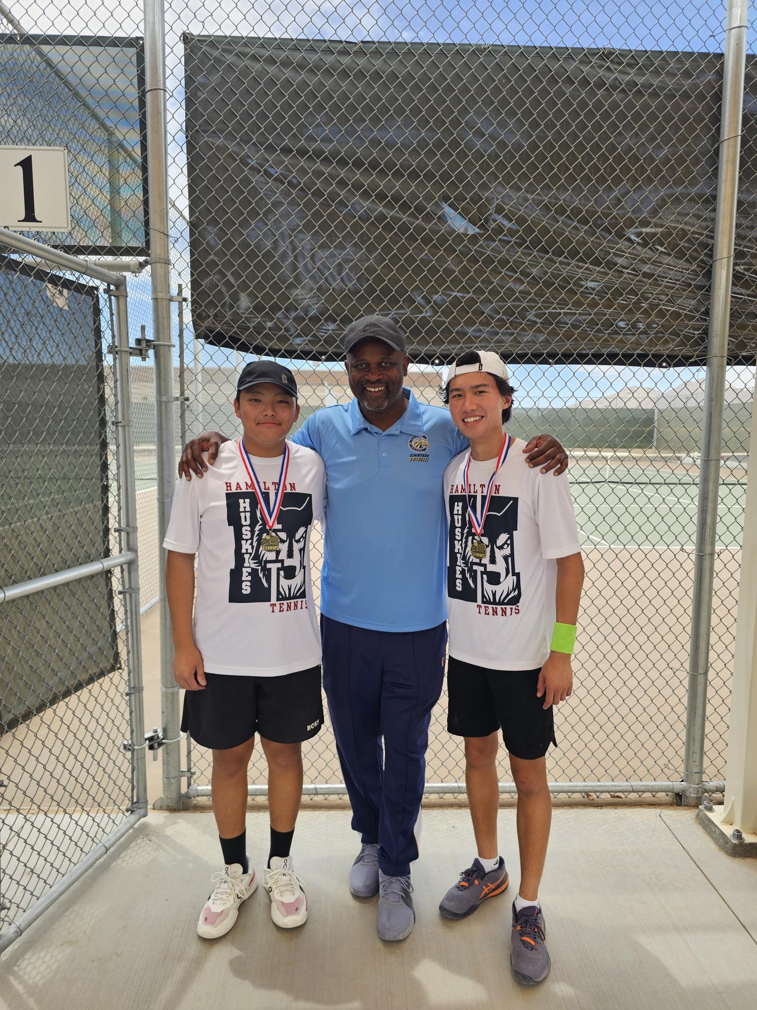 UPTA coach with medal-winning students at tournament