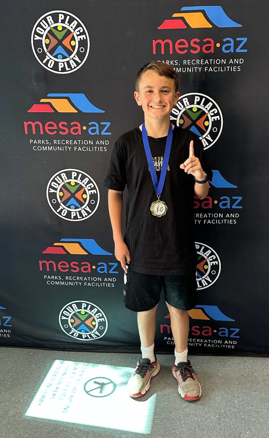 Brady winning 1st place at Mesa Tournament